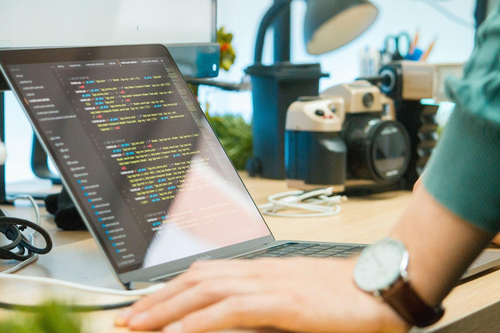 Person Checking the code - Machine Learning Best Practices