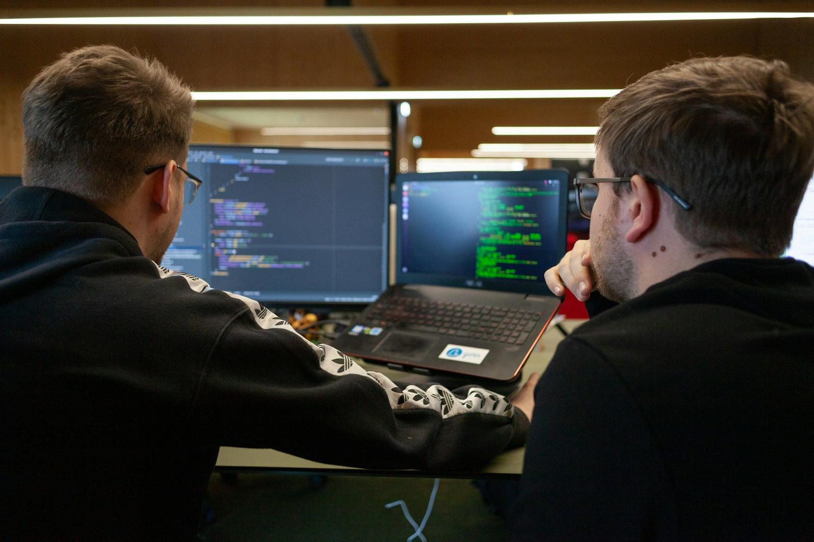 Programmers Discussing - Machine Learning Orchestration