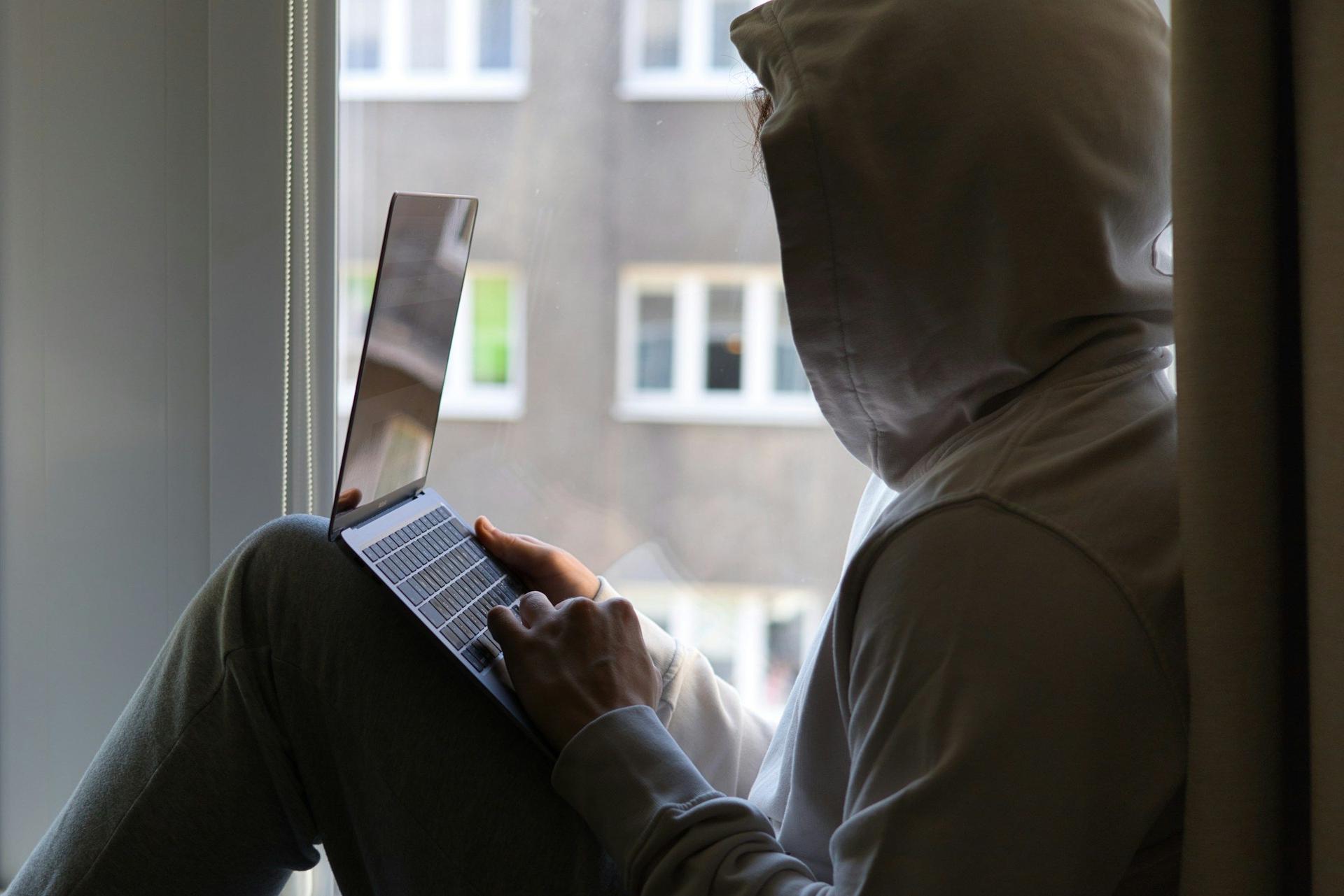 Person Using Laptop - AI Infrastructure Ecosystem