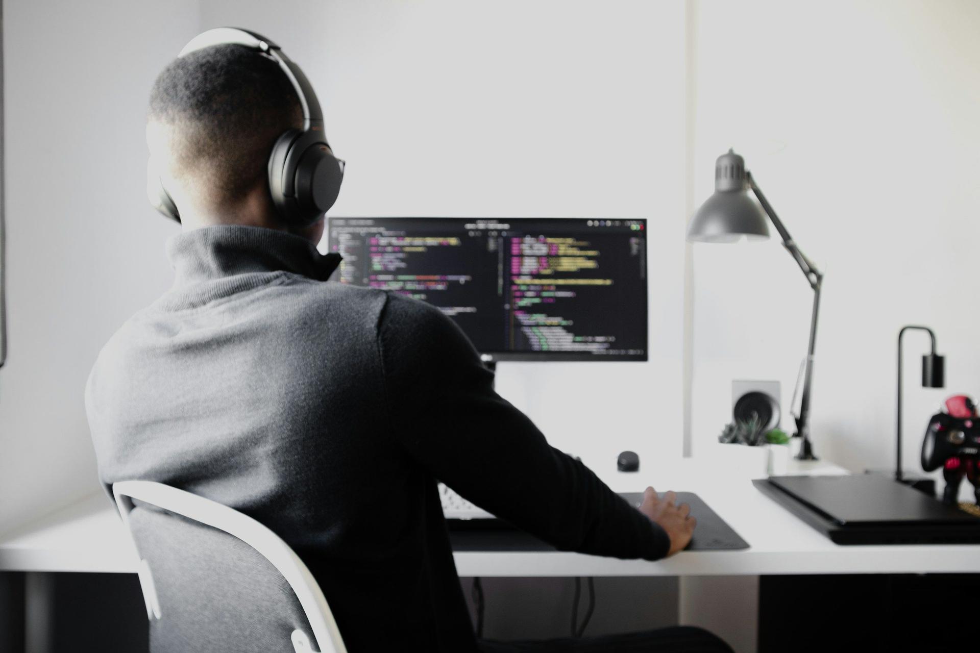 man coding at home